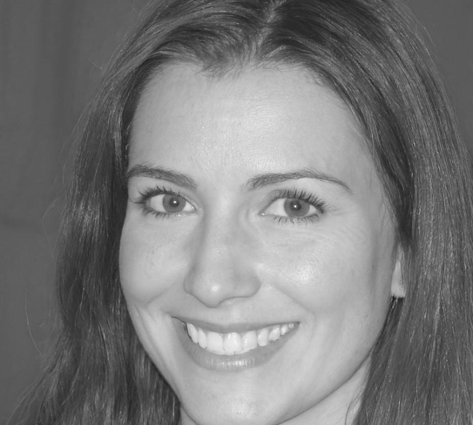 Finance program instructor Elowen Underhill reviewing student work